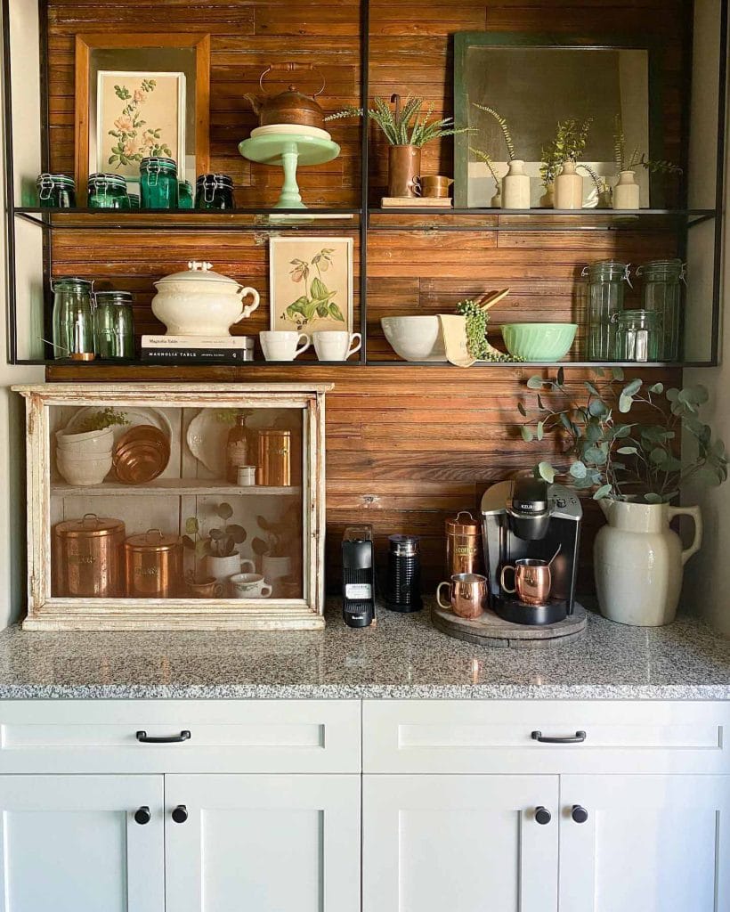 A coffee bar that incorporates natural elements with wooden shelves, greenery, and neutral-toned accessories. The blend of organic textures and minimalist design creates a calm and inviting space.