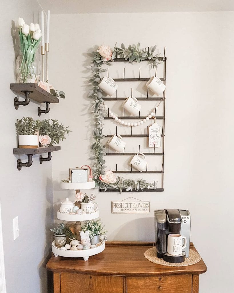 A charming coffee bar with floral accents, pastel decor, and a white backdrop. The delicate and feminine design adds elegance and freshness to the space.