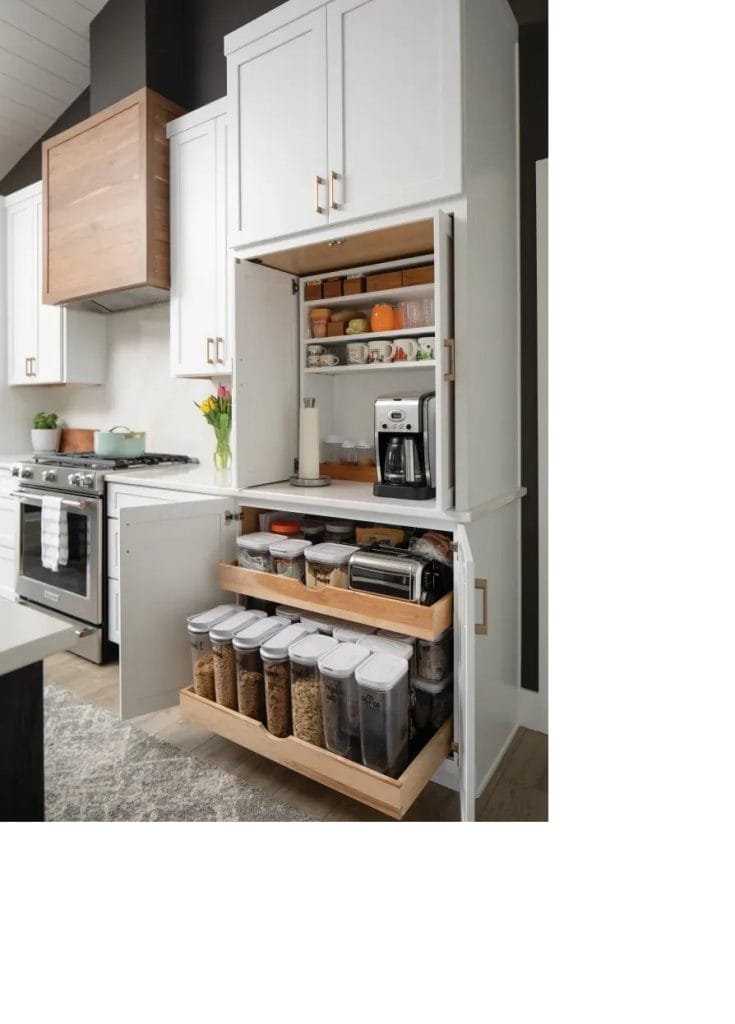 Hidden coffee station behind closed doors with pull-out drawers and shelves for storage.