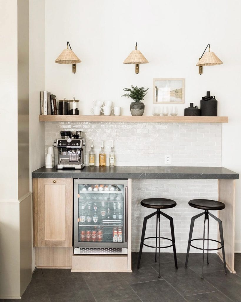 Coffee station with wooden shelves, neutral tones, and plenty of greenery for a natural vibe.