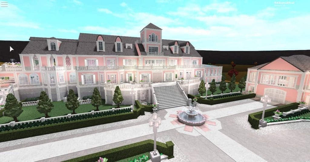 An opulent pink mansion with grand staircases, a central fountain, and lush gardens, exuding luxury and sophistication.