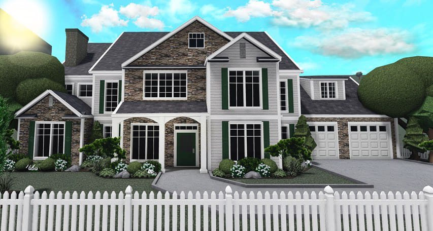 A classic suburban home with a mix of stone and siding, elegant green shutters, and a well-manicured lawn surrounded by a white picket fence.