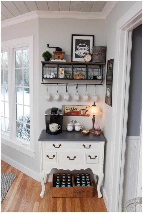 Quaint coffee setup with repurposed vintage dresser, hooks for mugs, and shelf for decor items.