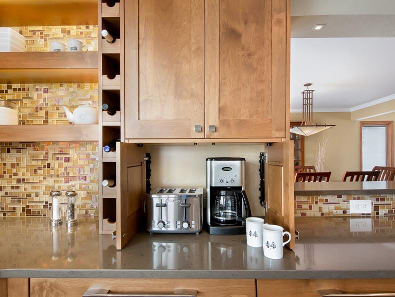 A stylish coffee bar with built-in cabinetry, an espresso machine, and ample storage, integrating seamlessly with the kitchen.