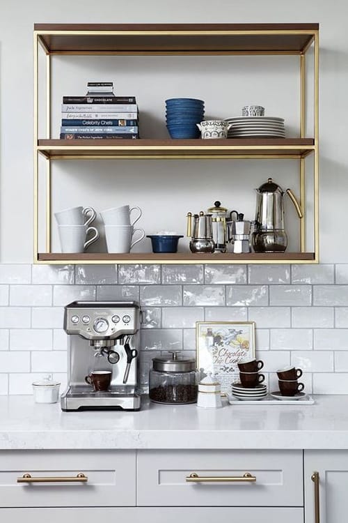 A station combining a coffee bar with a tea section, featuring stylish canisters and a modern coffee maker.