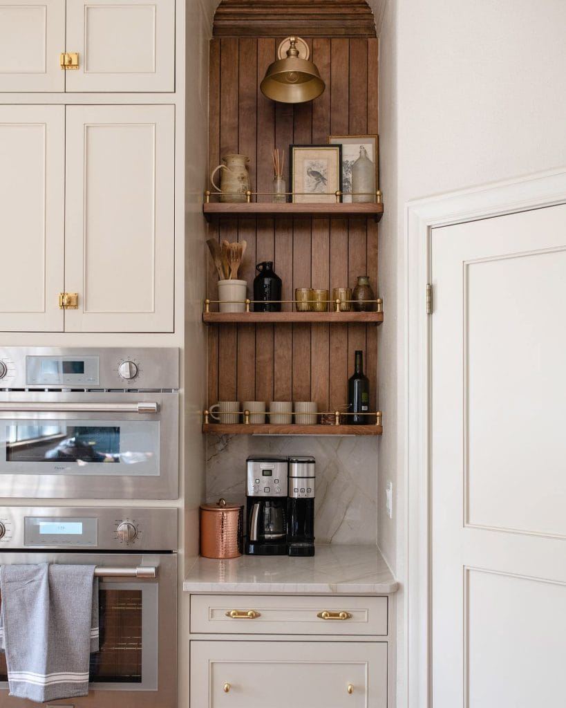 A coffee station with natural wood accents and earthy tones, featuring a modern coffee maker and decorative elements.