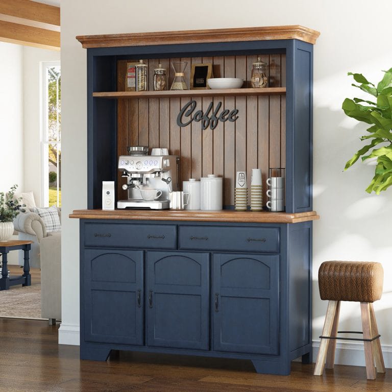 A cozy coffee bar with a wooden cabinet, open shelving, and a mix of rustic and contemporary decor, including mugs, plants, and accessories.