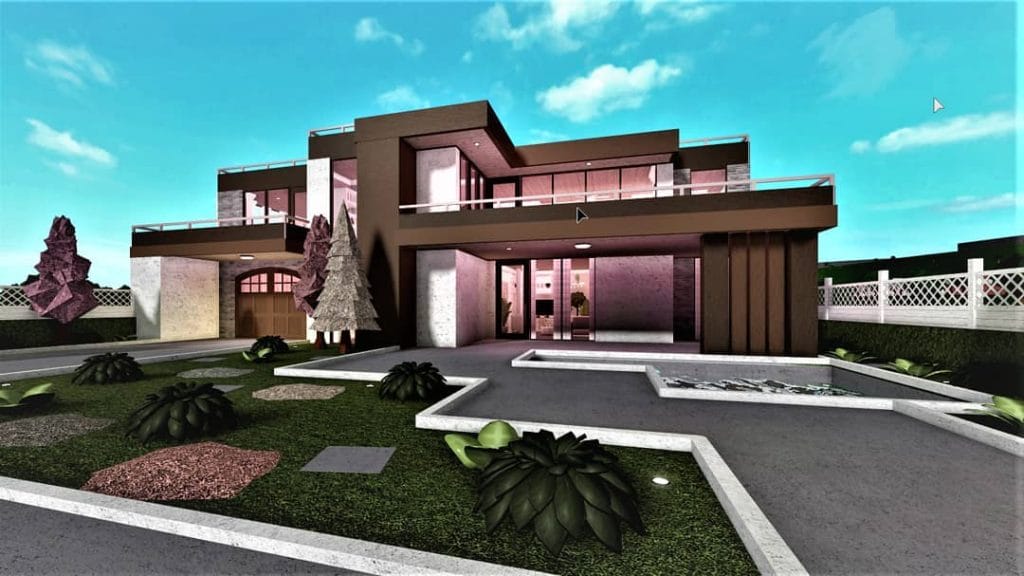 A modern family house with a blush-colored exterior, spacious rooms, and a lovely garden.