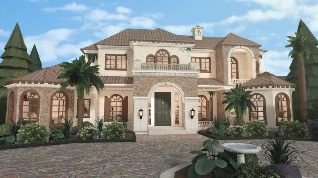 A warm Mediterranean-style family home with stucco walls, terracotta roof, and a beautiful garden.