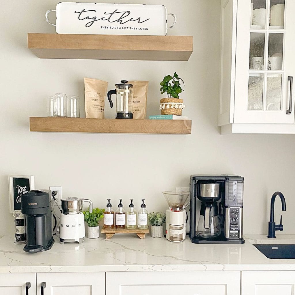 A cozy corner coffee bar with warm wood tones, open shelving, and a well-organized display of coffee essentials. The inviting setup is perfect for a small, intimate space.