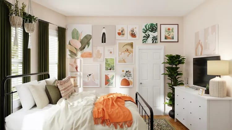 Dorm room with vibrant art pieces, green curtains, and an orange throw blanket.