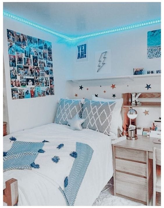 Dorm room with blue LED lights and photo collage wall.
