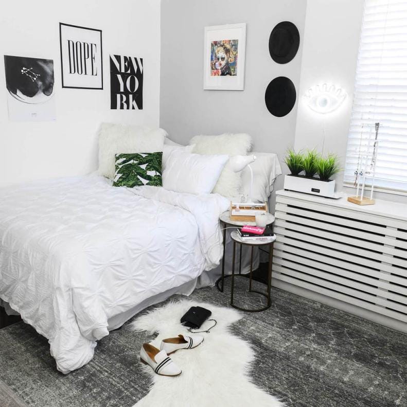 Dorm room with monochrome black and white decor.