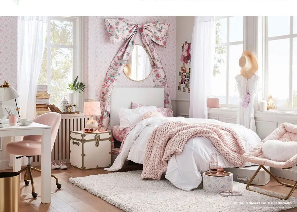 Romantic dorm room with floral decor and a large bow above the bed.