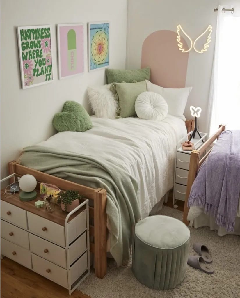 A serene bedroom with green and pastel decor, soft textures, and whimsical elements.