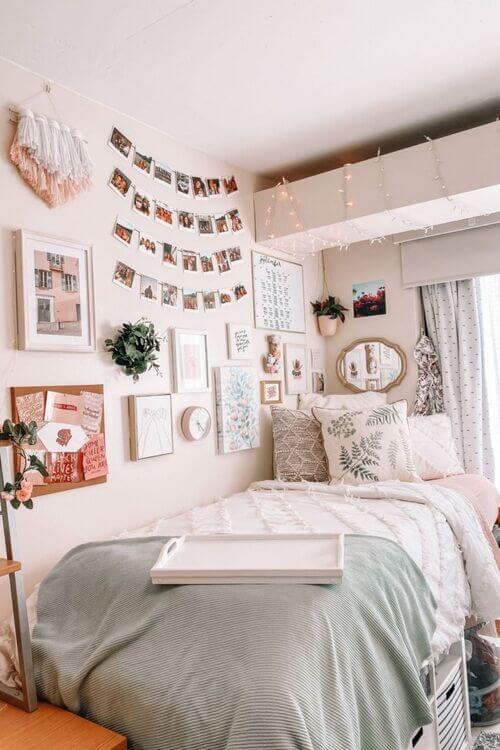 A serene dorm room with floral patterns, pastel colors, and a personalized gallery wall.