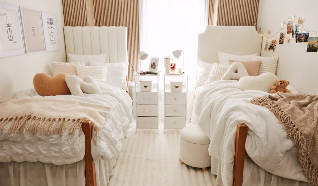 Elegant twin bed setup with neutral colors, plush textures, and matching bedside tables.