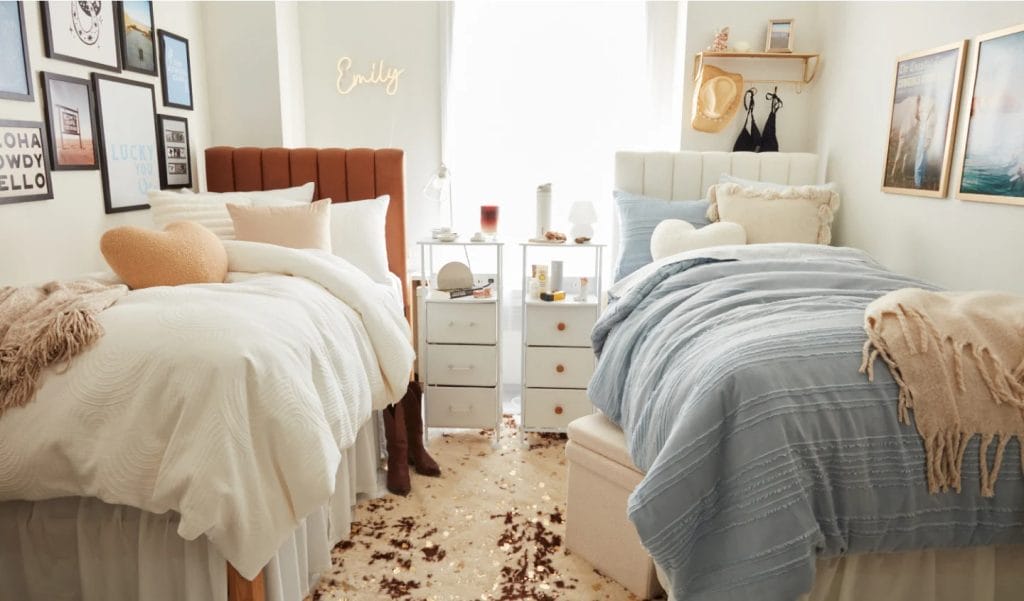 A shared bedroom with two beds, one side decorated in earthy tones and the other in soft blues, with a mix of textures and coordinating decor.