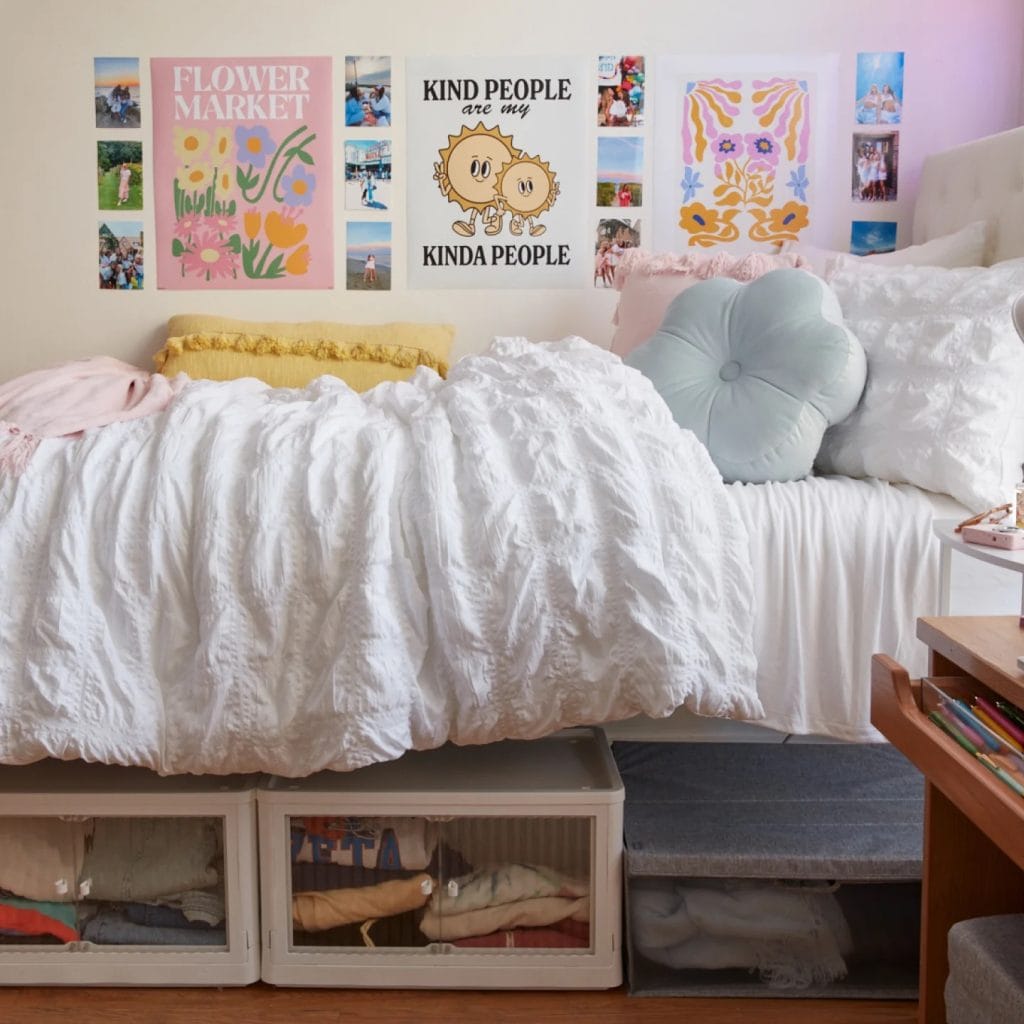 Bed with bright bedding, under-bed storage, and colorful wall art.