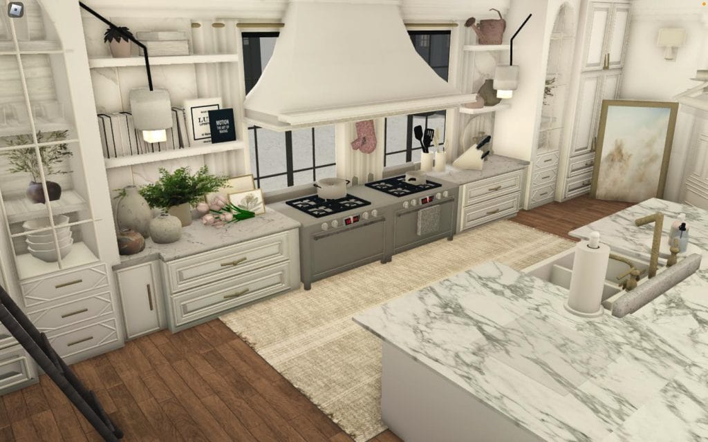 A large Bloxburg kitchen with dual stoves, a marble island, and open shelving decorated with neutral-colored items.