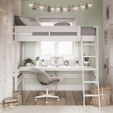 A space with a loft bed and study area underneath, light green walls, and string lights.