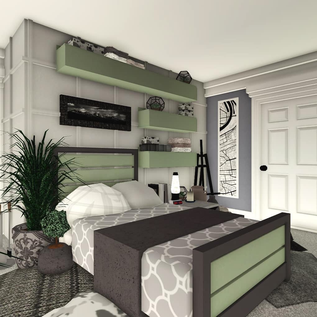 A modern farmhouse bedroom with muted green and gray decor, geometric shelving, and cozy bedding.