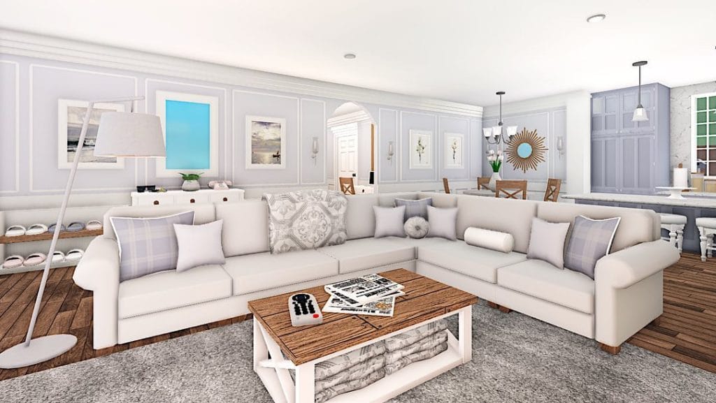 Bloxburg living room with light decor, sectional sofa, and modern artwork.