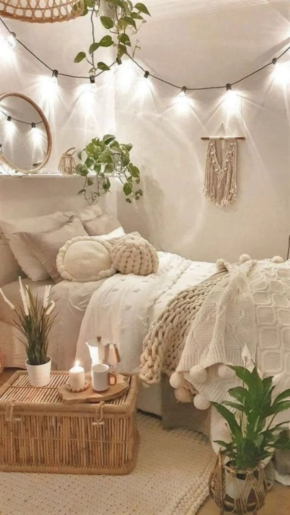 A space with soft beige tones, greenery, string lights, and bohemian decor.