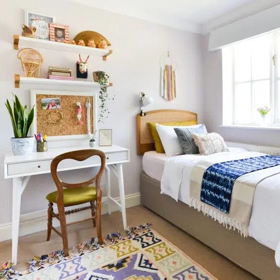 Bright and cheerful study nook with a white desk, corkboard, and colorful decor.