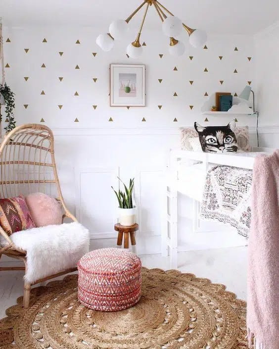 Modern Scandinavian-inspired room with a loft bed, comfy chair, and geometric decor.