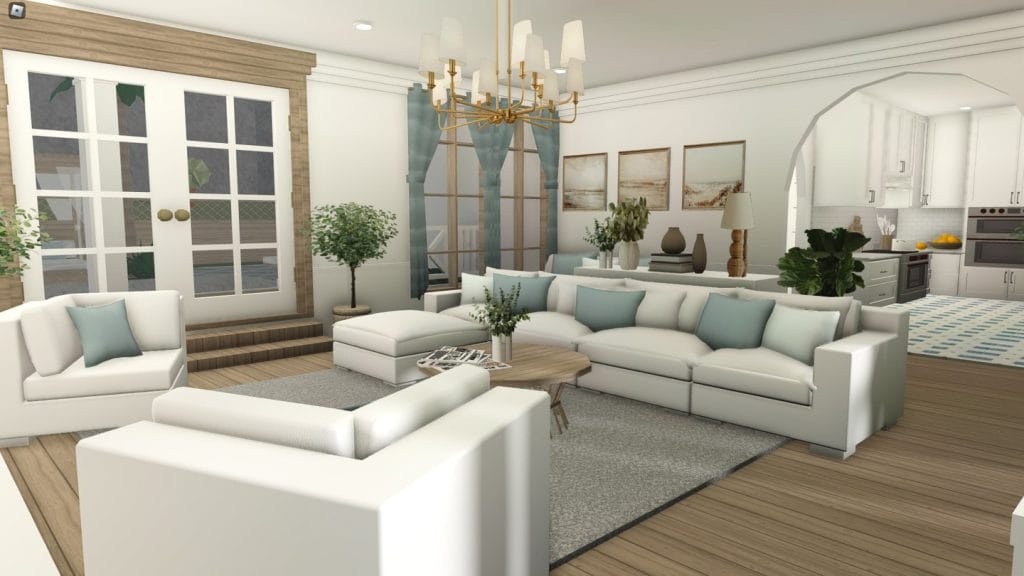 Coastal Bloxburg living room with white sofas, blue accents, and large windows.