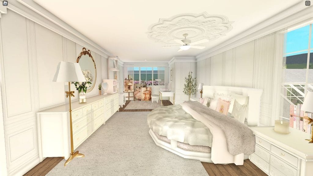 An elegant bedroom with a neutral color palette, plush bed, large dresser, and tasteful decor.