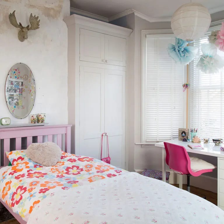 A vibrant space with floral bedding and cheerful decor.