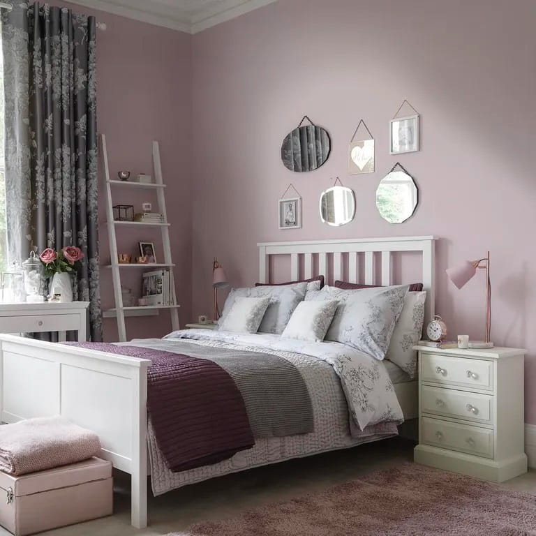 A serene space with soft lavender walls and elegant white furniture.