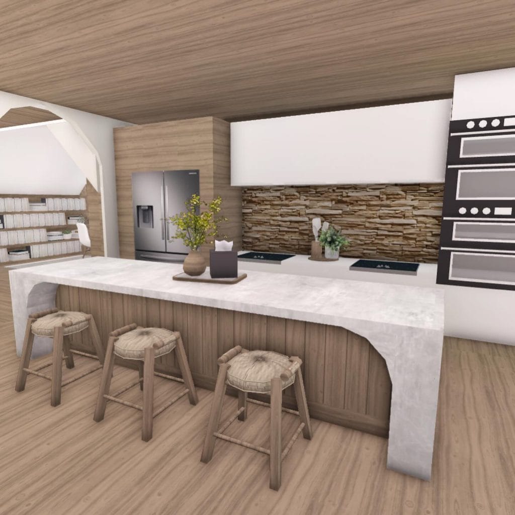 A modern minimalist Bloxburg kitchen with light wood tones, sleek white surfaces, and clean lines.