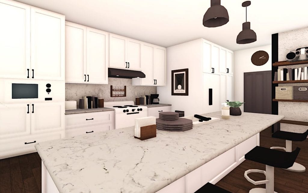 A modern Bloxburg kitchen with white cabinetry, marble countertops, and dark accents.