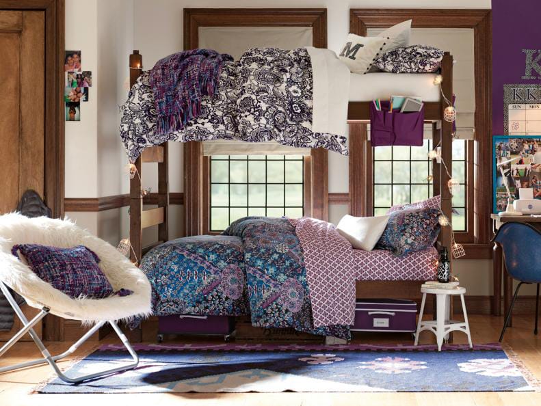 Teen bedroom with a lofted bed, boho-style bedding, hanging lights, and a fuzzy chair.