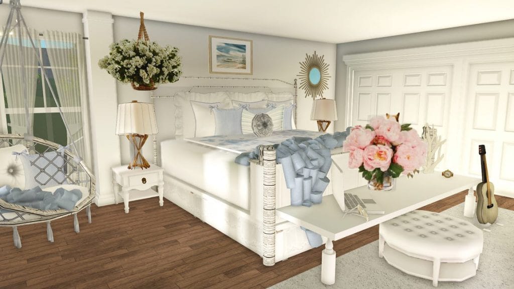 A fresh and airy bedroom with light blue and white tones, featuring a hanging chair, floral accents, and beach-themed wall art.