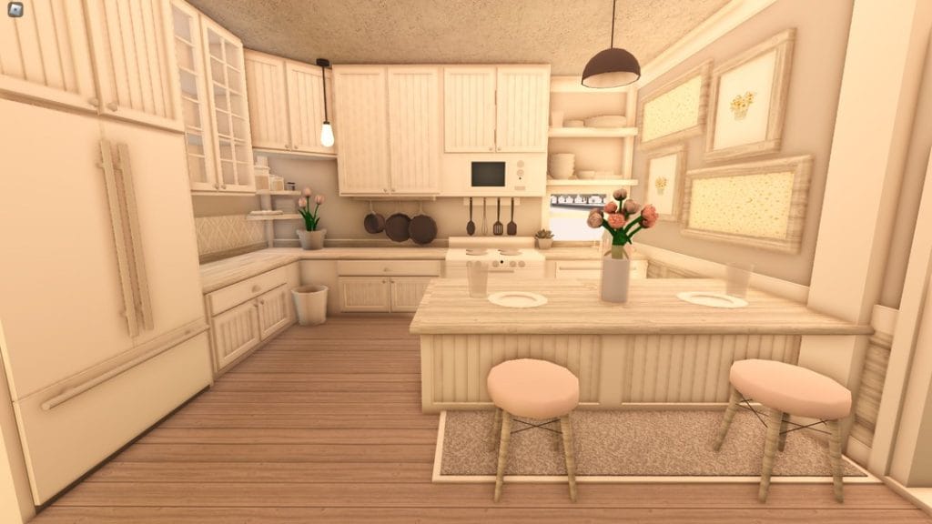 A cozy Bloxburg kitchen with pastel colors, ample storage, and a seating area by the island.