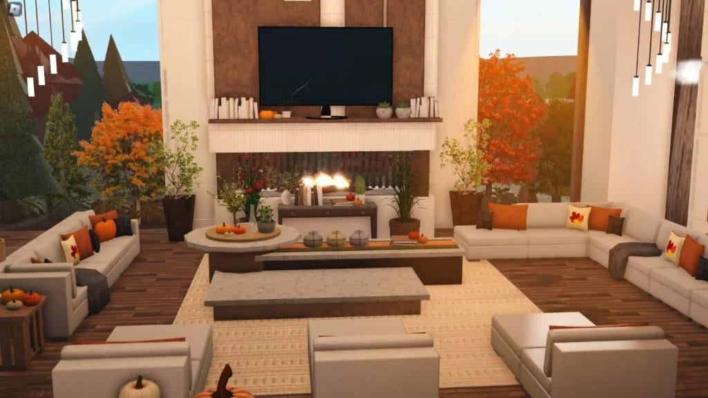 A modern living room with autumn decorations and a cozy fireplace in a hillside mansion.