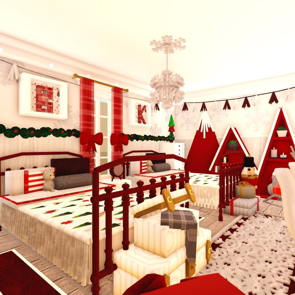 A twin bedroom decorated for Christmas with red and white decor, plaid patterns, and festive garlands.