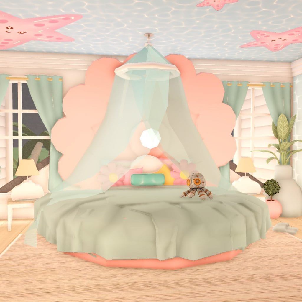 A whimsical bedroom with a round bed, pastel colors, and beach-themed decor, featuring a floral headboard.