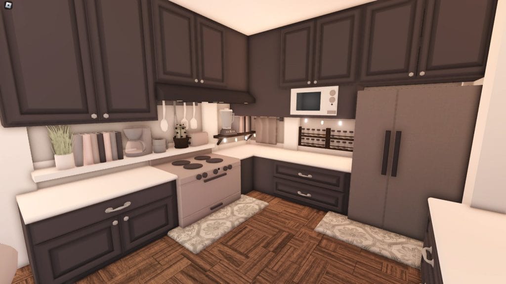 A modern Bloxburg kitchen with dark cabinetry, modern appliances, and a spacious layout.