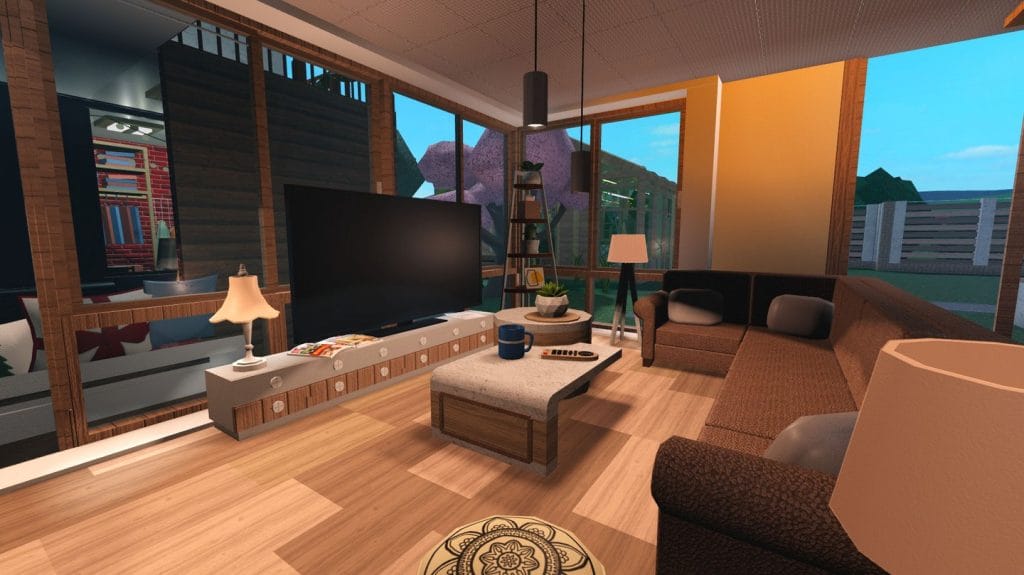 Modern living room with a dark brown sectional sofa and a large TV.