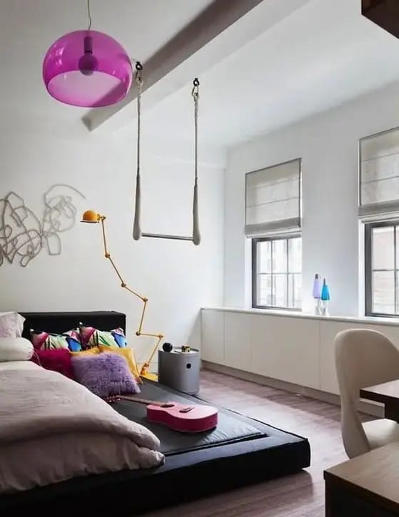 Modern teen bedroom with a swing chair and minimalistic design.