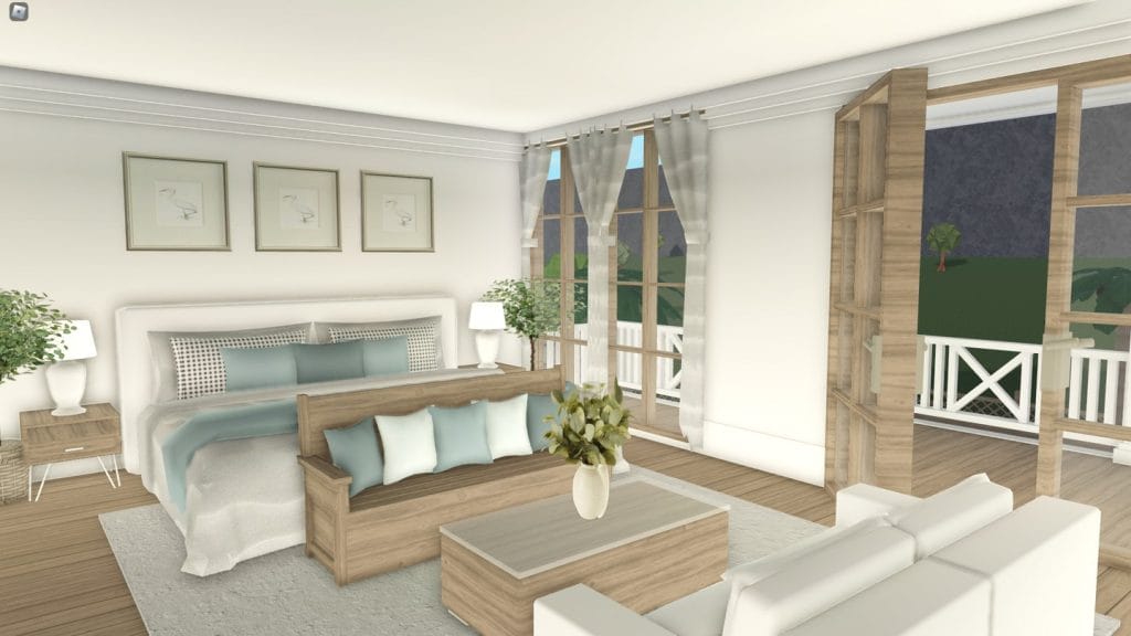 Coastal family beach house bedroom with soft colors, beachy decor, and large windows for natural light.