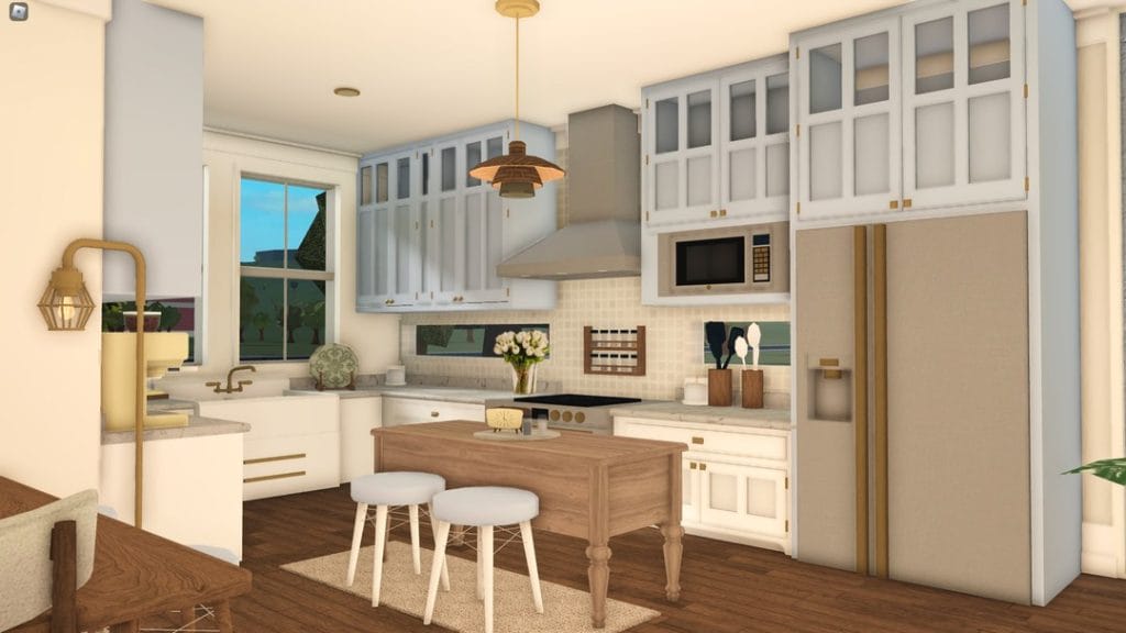 A coastal farmhouse kitchen with white cabinetry, ocean-inspired accents, and a large island.