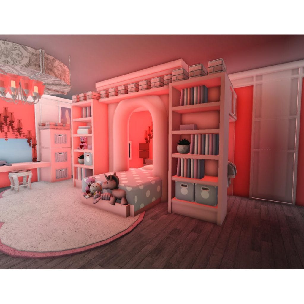 A princess-themed bedroom with a built-in bed, shelves, and vanity area.