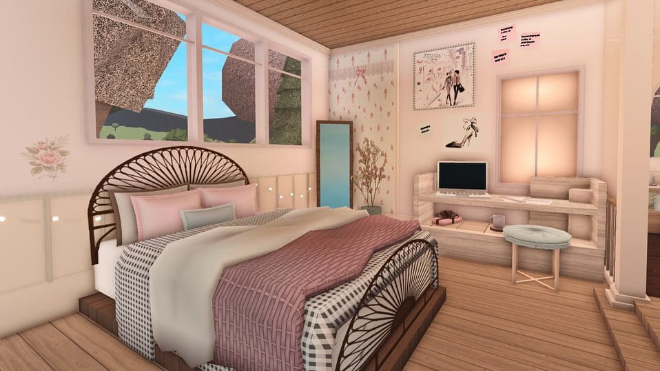 A small bedroom with a loft bed, study area, and pink-toned decor in a modern style.