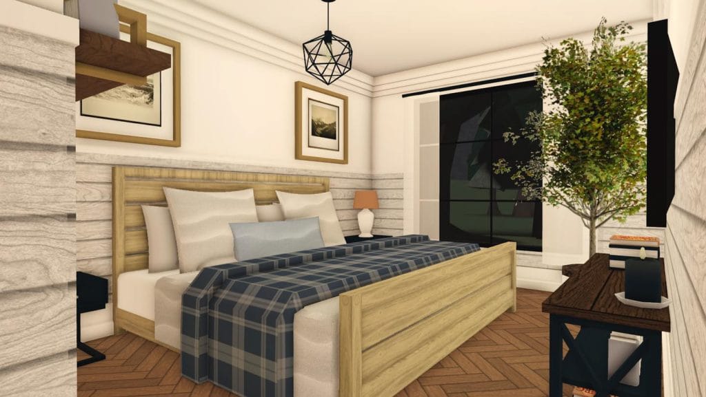 Bedroom with a plaid-patterned bedspread, neutral decor, and subtle blue accents.